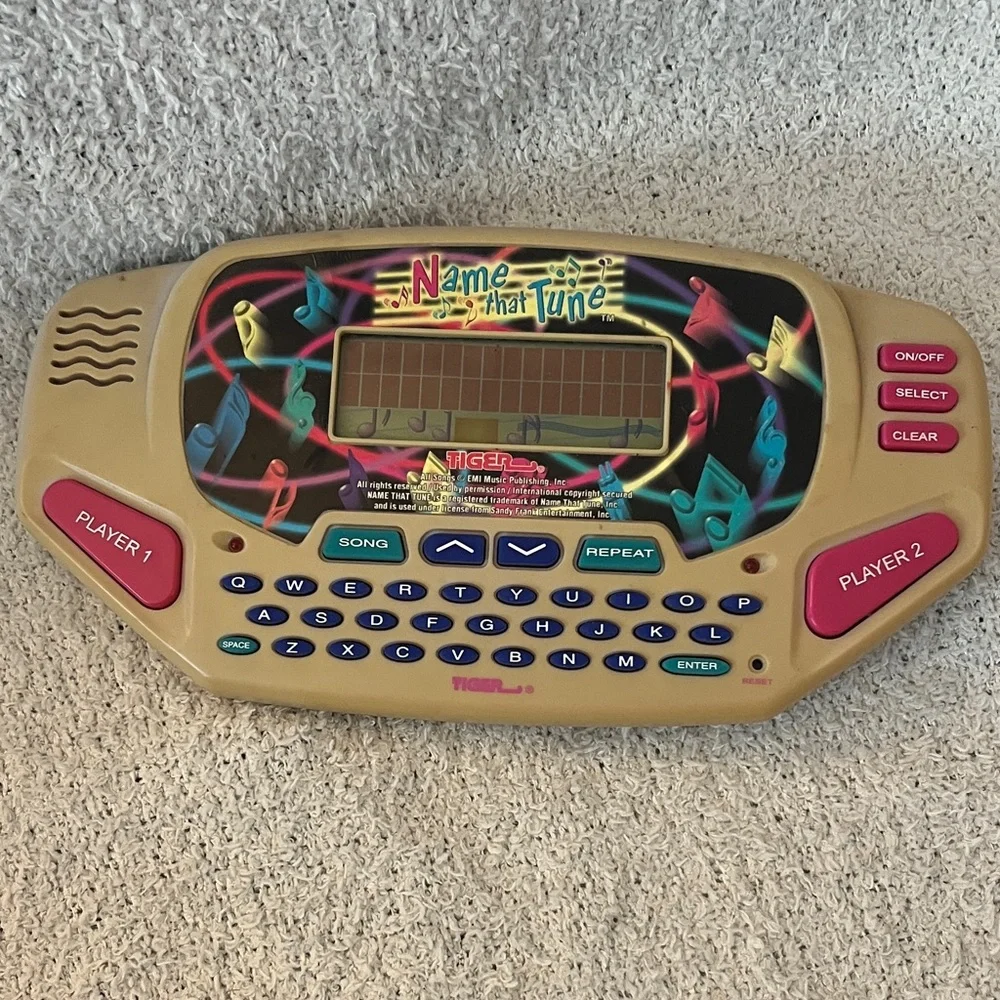 Name That Tune Handheld Game with country and western hits game Tiger toy